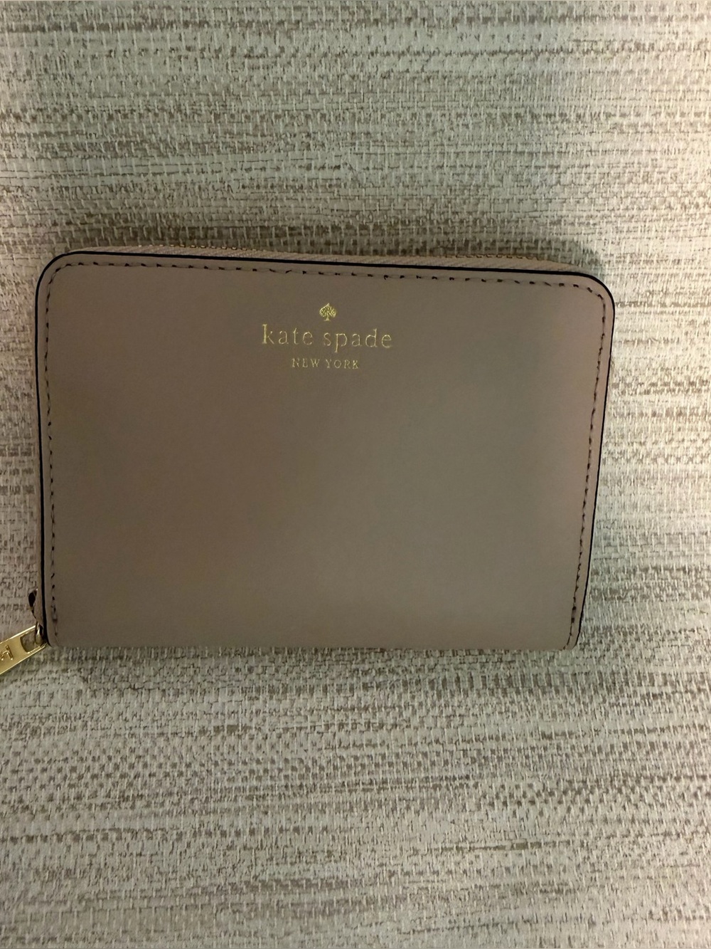 Kate Spade Small zip around wallet.  Black fabric inside